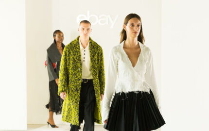 Three models walk beneath the eBay logo at its 2026 London Fashion Week Endless Runway show