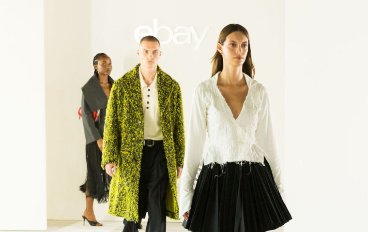 Three models walk beneath the eBay logo at its 2026 London Fashion Week Endless Runway show