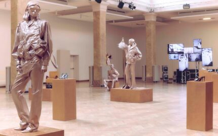 Jimmy Choo Spring 2027 Character Studies presentation with metallic figures and shoes on display