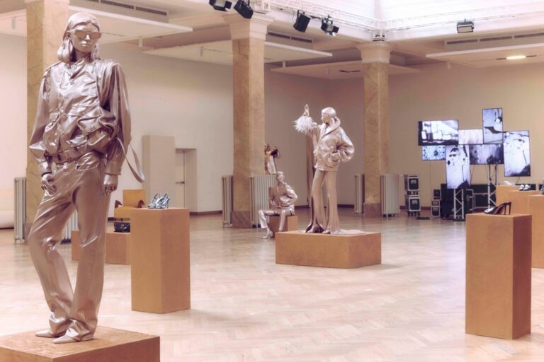 Jimmy Choo Spring 2027 Character Studies presentation with metallic figures and shoes on display