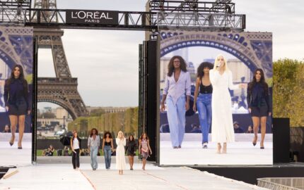 Elena Rose and performers on the L’Oréal Paris Le Défilé 2026 stage near the Eiffel Tower