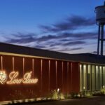Loro Piana Ghemme factory exterior illuminated at dusk