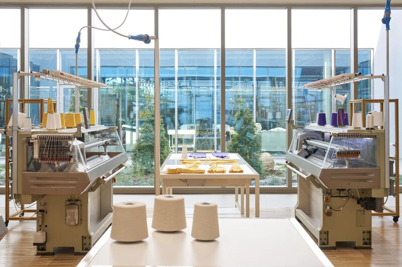 Knitting machines and yarn inside the Loro Piana Ghemme centre