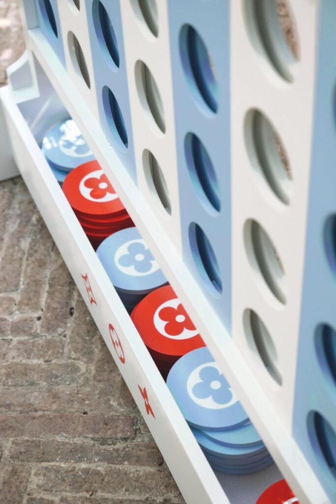 Louis Vuitton family game with red and blue counters