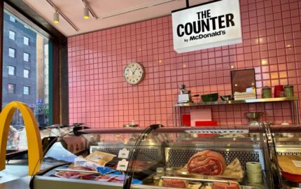 Butcher-style counter and McDonald’s signage at the pop-up