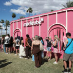 Visitors queued outside a pink Medicube activation at Coachella.