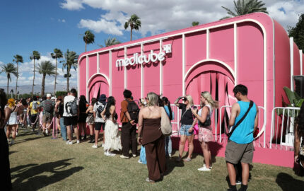 Visitors queued outside a pink Medicube activation at Coachella.