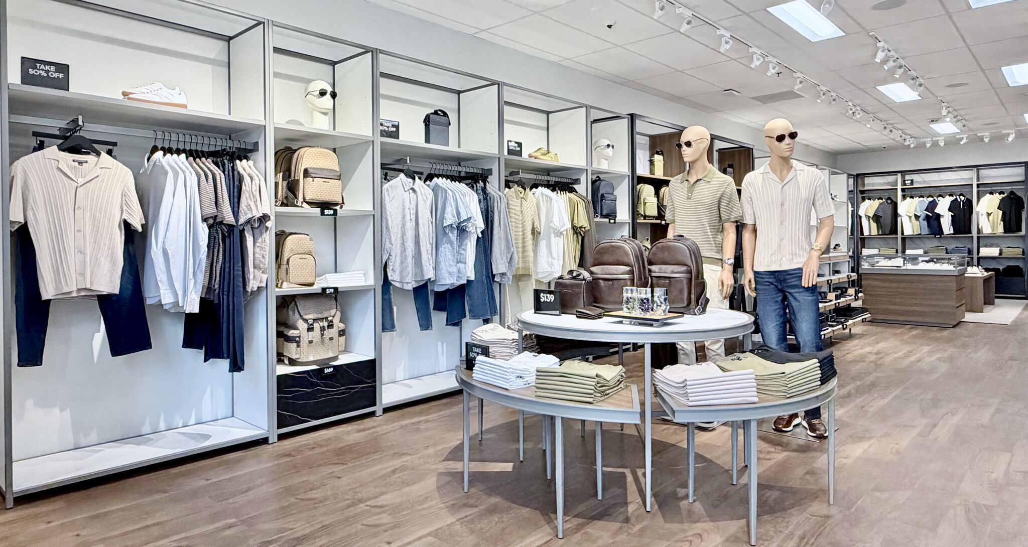 Apparel and accessories arranged inside Michael Kors Mens