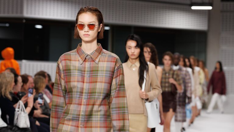 Models on the runway at the Mulberry by Christopher Kane debut show in London