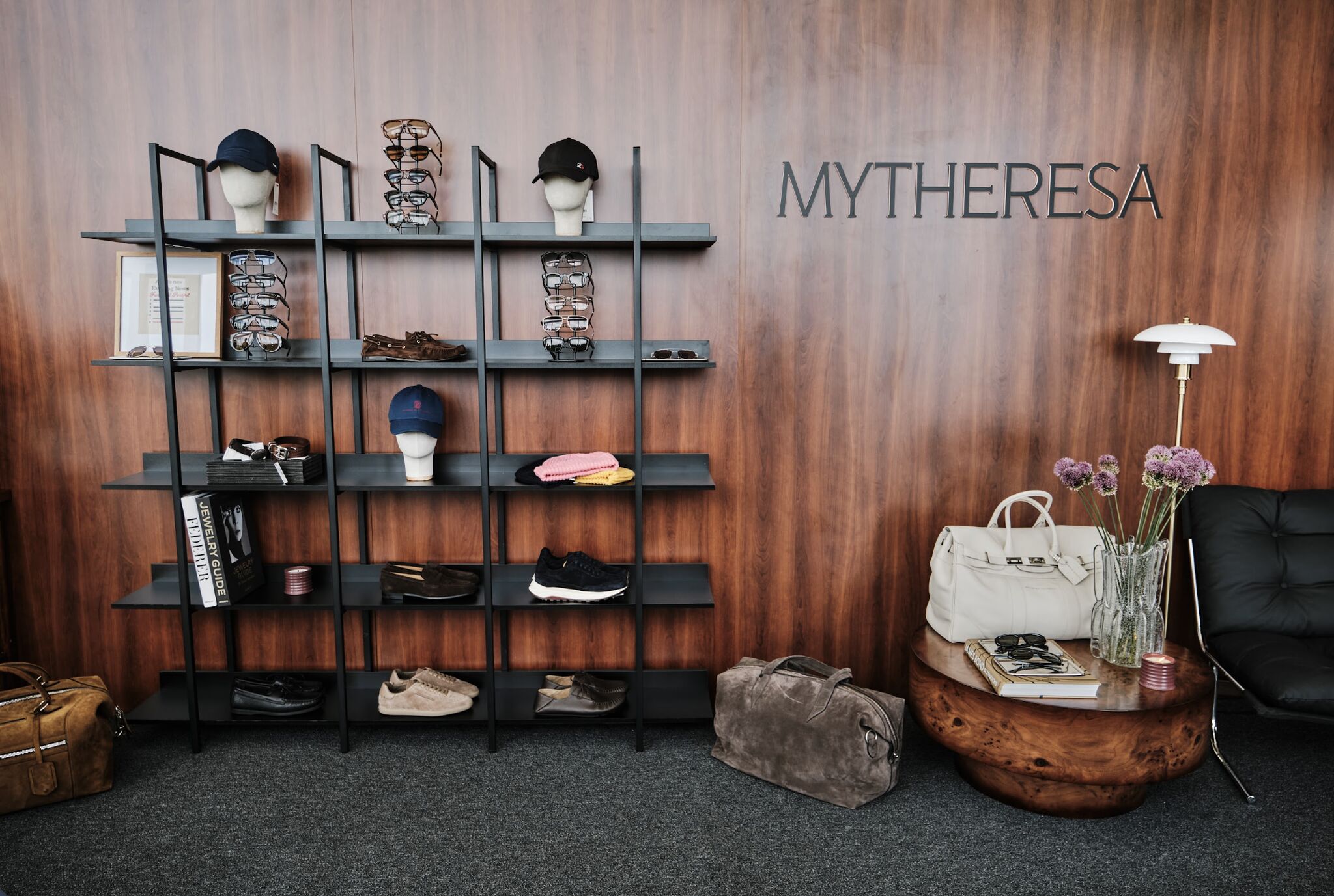 Mytheresa men's shopping lounge and merchandise display at The Bridge Golf Club