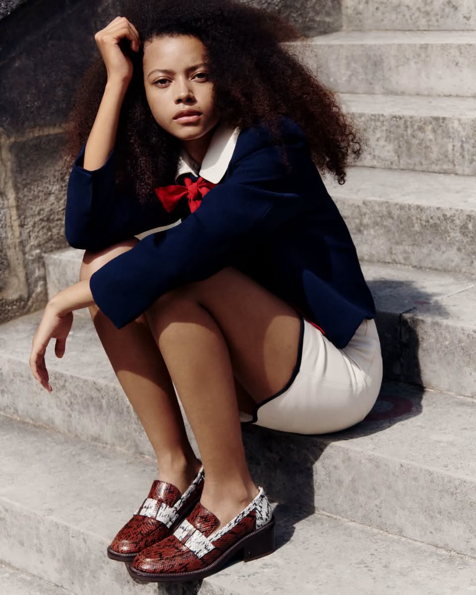 Model wearing Jimmy Choo patterned loafers in the Mytheresa exclusive campaign