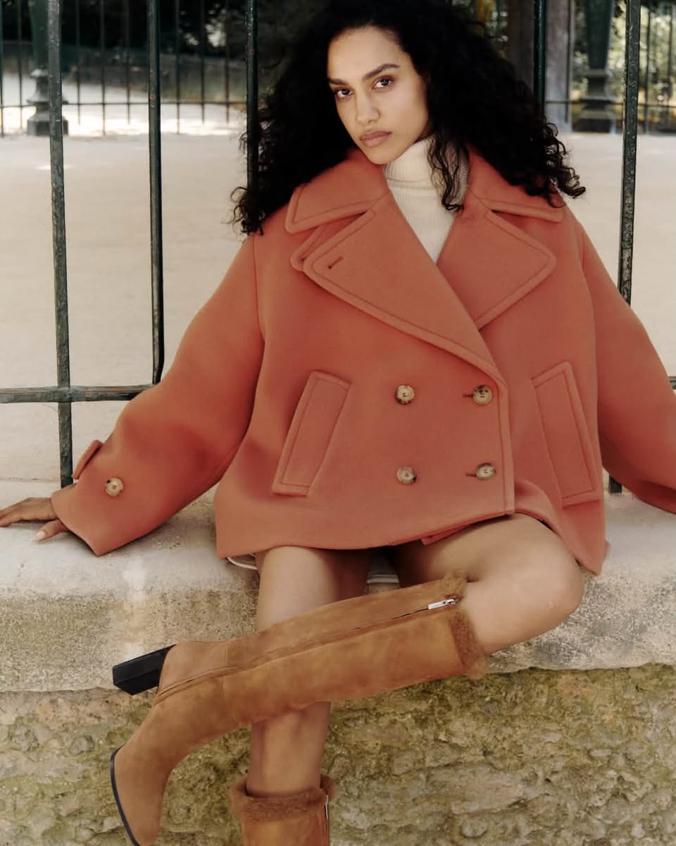 Model wearing tall suede boots in the Mytheresa and Jimmy Choo campaign
