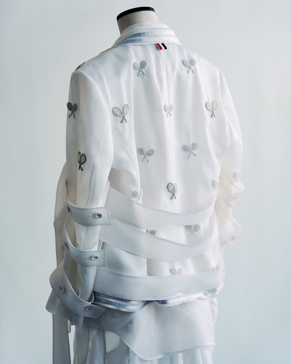 Rear view of the custom Thom Browne garment with white and silver tennis-racket appliqués