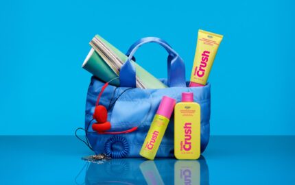 Old Navy Beauty Co. Vanilla Crush products styled with a blue bag and headphones