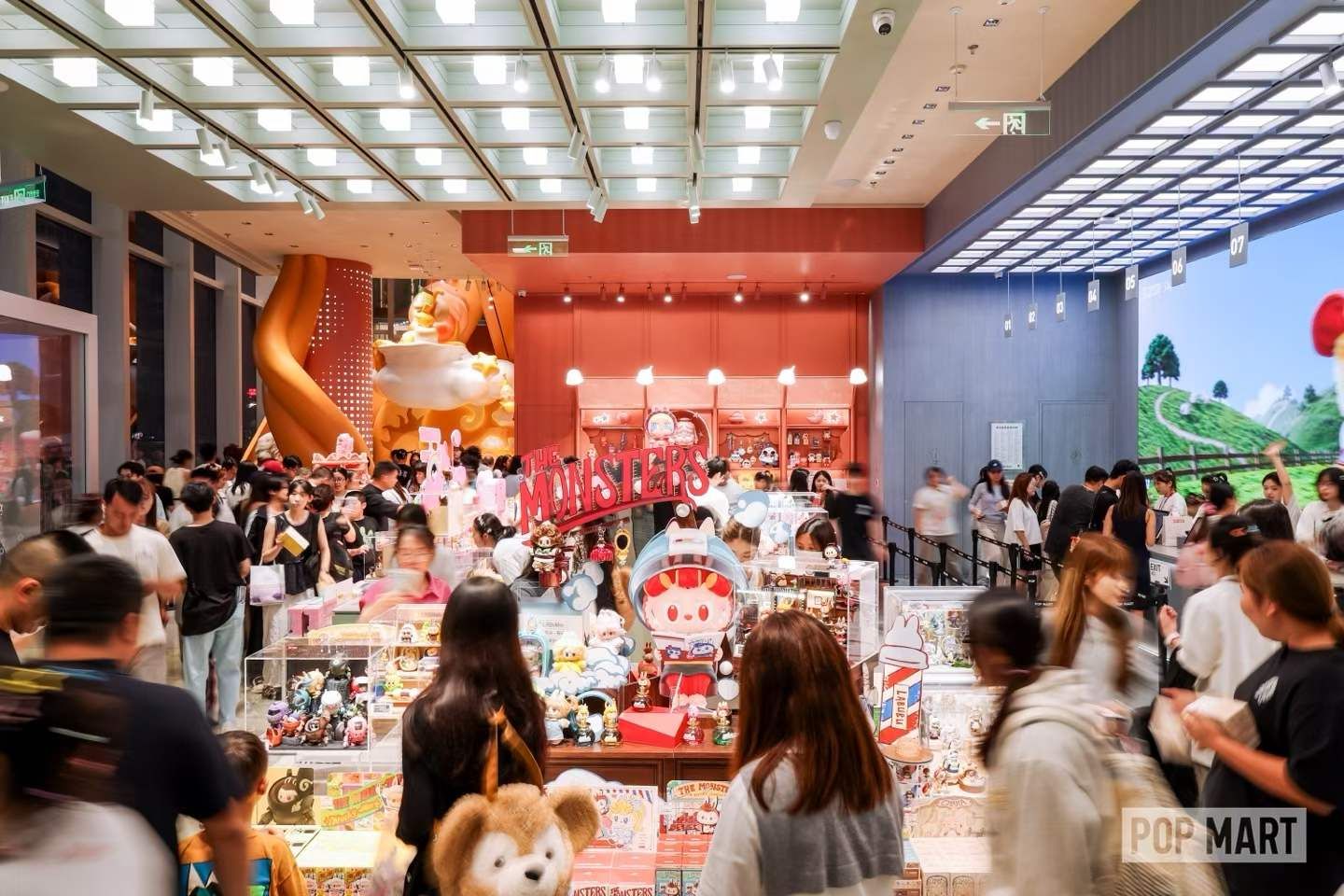 Shoppers browsing POP MART’s colourful Changsha store interior