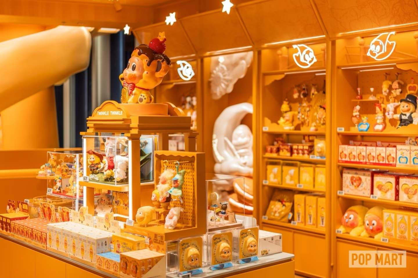 Orange character displays and boxed merchandise at POP MART Changsha