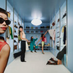 Poshmark fashion campaign set inside a blue wardrobe.