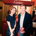 Guests at the Cartier Cinema Club event beside a Cartier popcorn stand