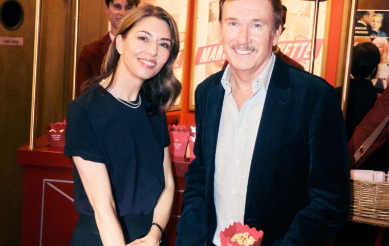 Guests at the Cartier Cinema Club event beside a Cartier popcorn stand
