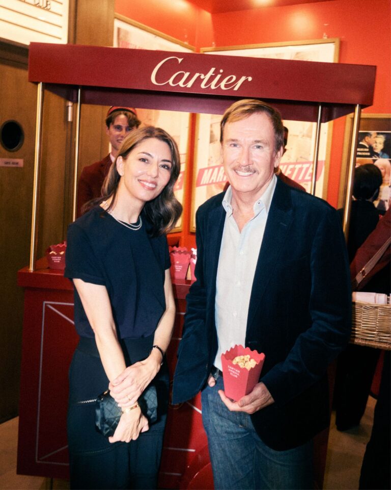 Guests at the Cartier Cinema Club event beside a Cartier popcorn stand