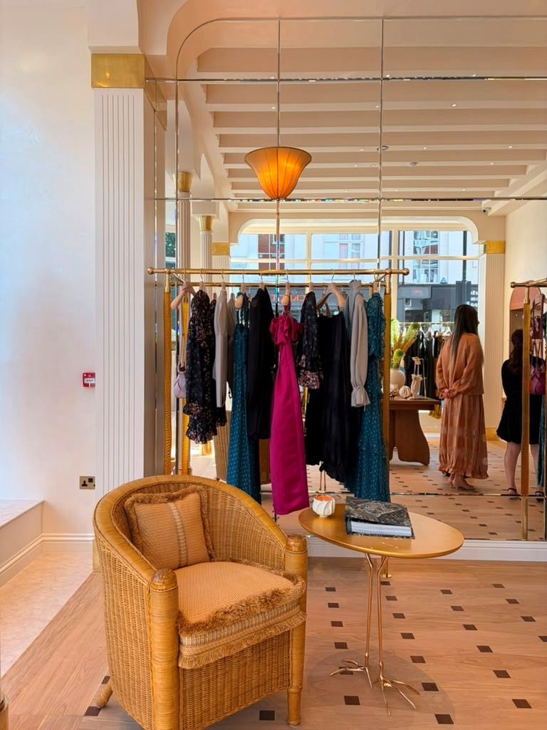 Interior of Ulla Johnson’s London flagship with apparel displays