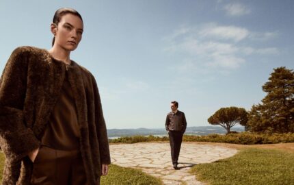 Two models in Vince fall clothing on a terrace in Italy.