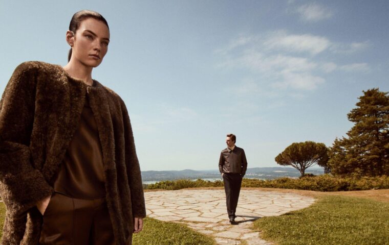 Two models in Vince fall clothing on a terrace in Italy.