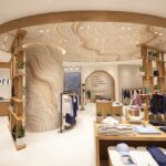 Interior of Vuori's Beijing Indigo store with mosaic ceiling and central display