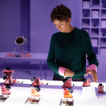Zendaya explores a Prada Beauty product display at the New York photo studio.