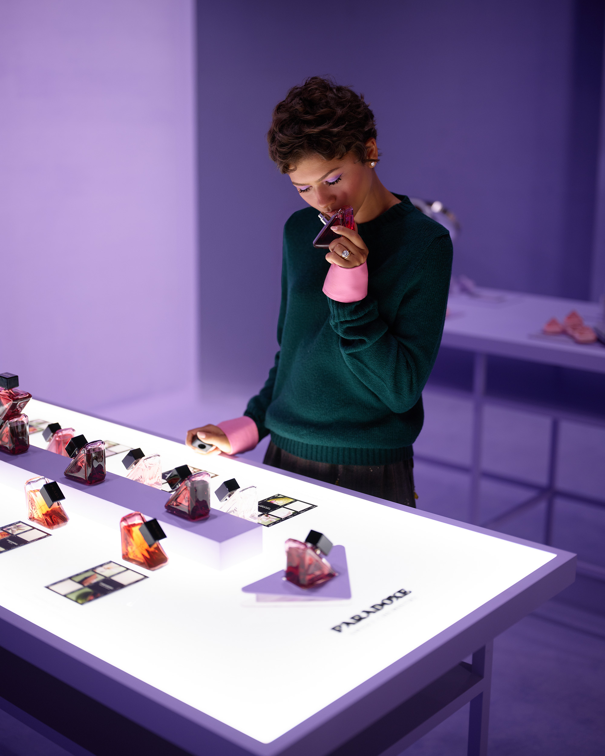 Zendaya samples fragrance at the Prada Beauty photo studio.
