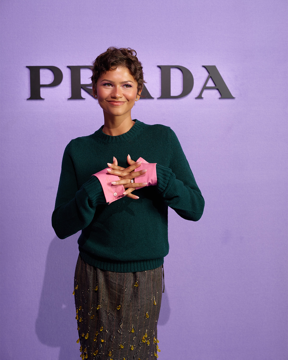 Zendaya poses in front of the Prada backdrop at the New York photo studio.