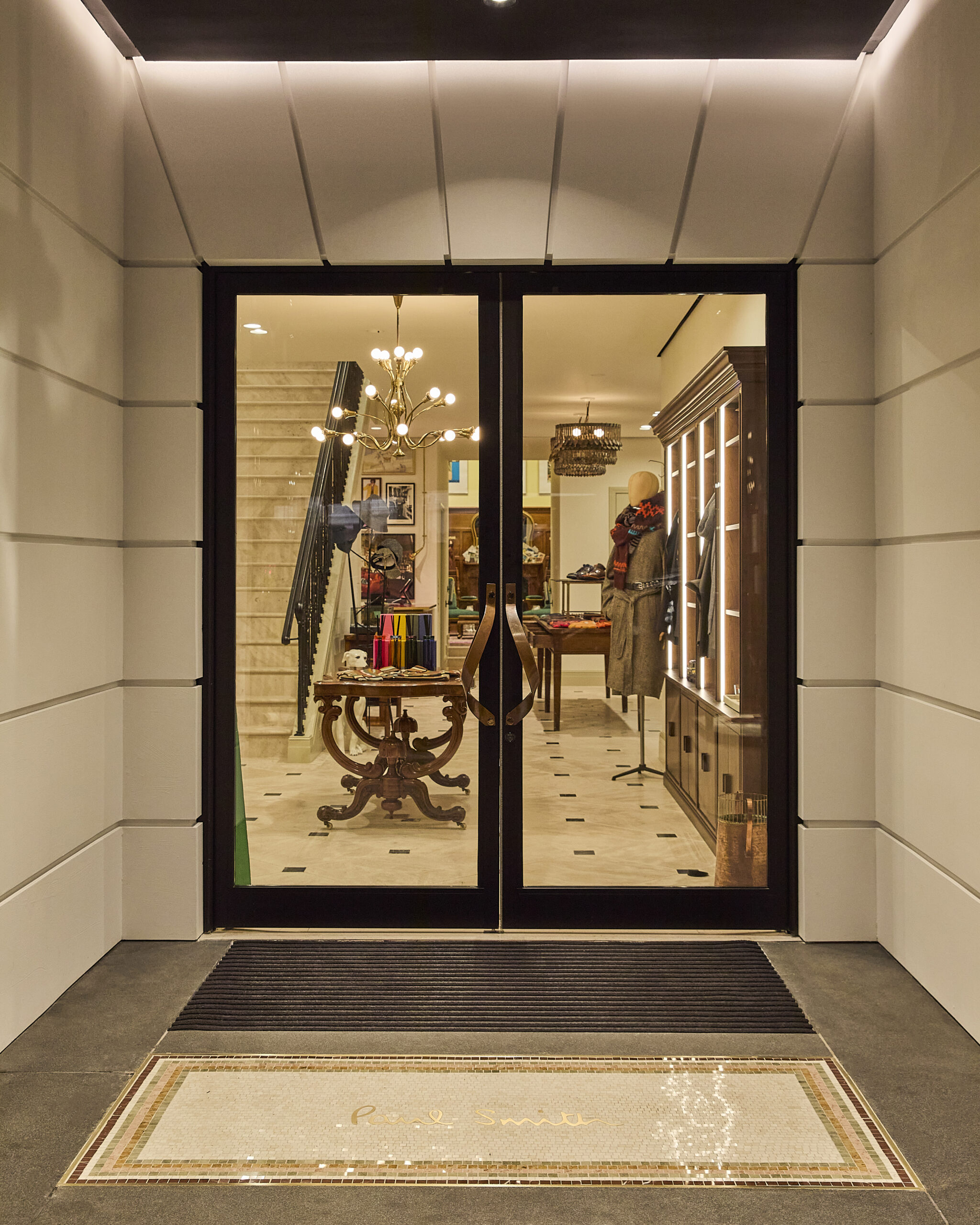Glass entrance doors and mosaic threshold at Paul Smith Madison Avenue