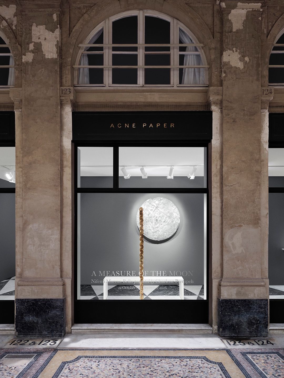 Acne Paper Palais Royal facade displaying A Measure of the Moon in Paris