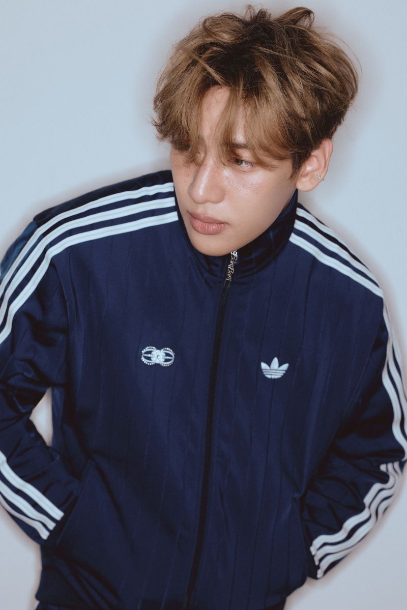 Blue adidas Originals tracksuit campaign portrait