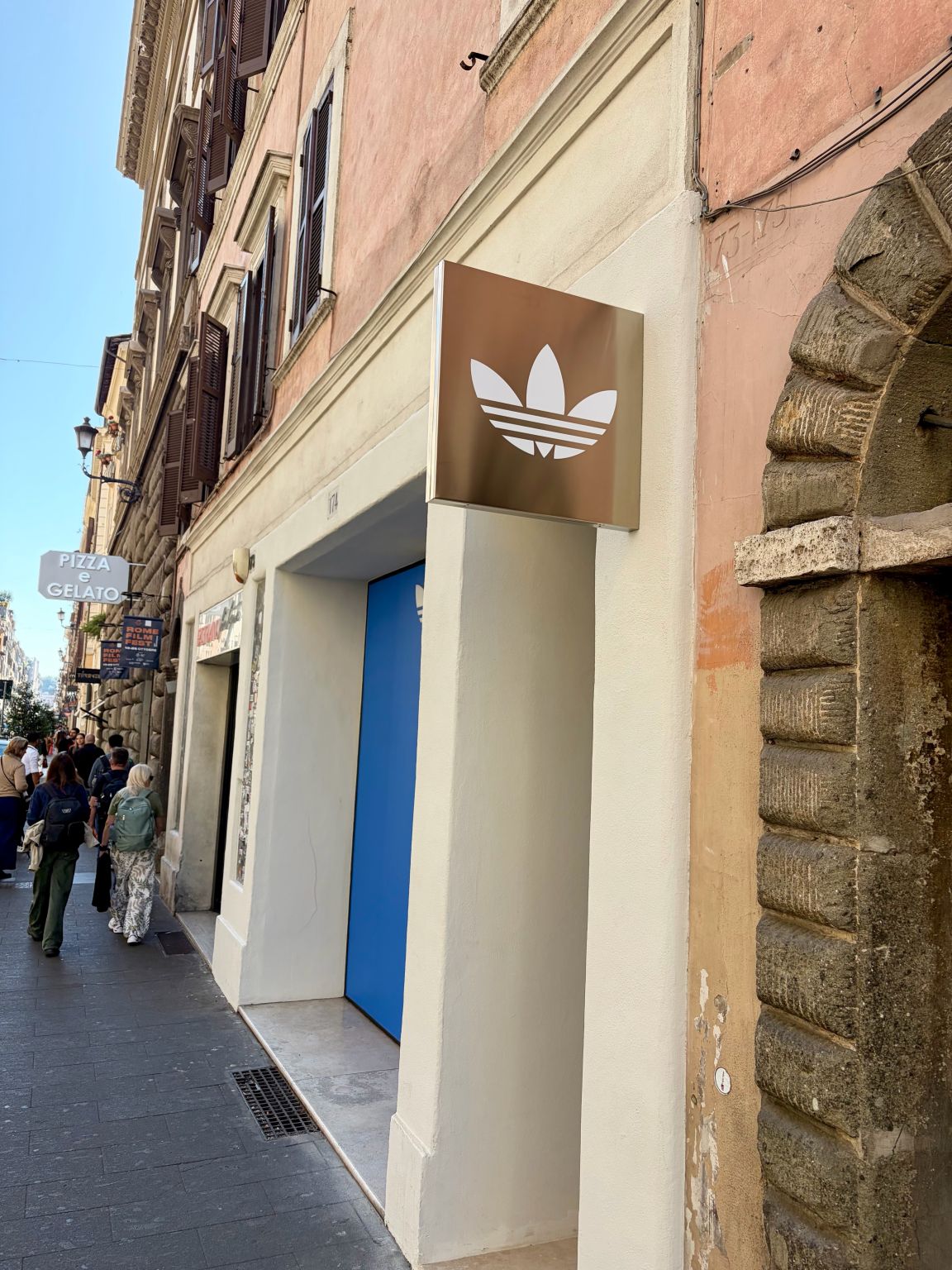 Via del Babuino storefront and trefoil sign at the adidas Originals Via del Babuino store in Rome.