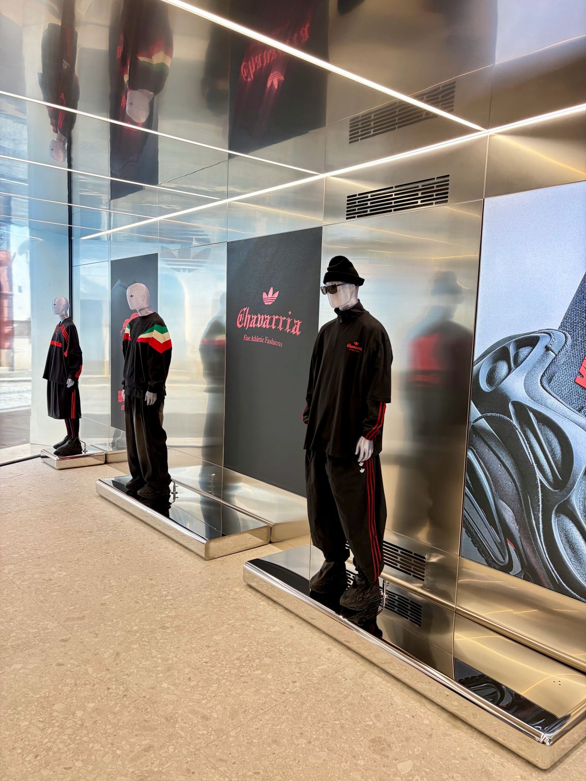 Mirrored entrance display and mannequins at the adidas Originals Via del Babuino store in Rome.