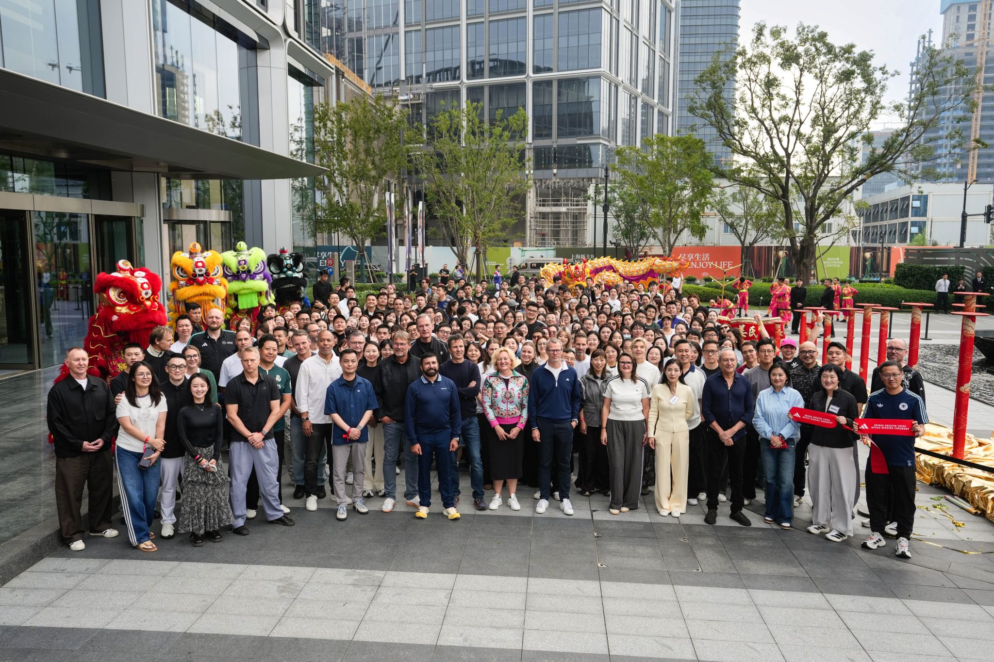 adidas teams gathered outside an office building in China