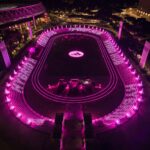 Aerial view of the pink-lit adidas Hybrid Hub at Rome’s Stadio dei Marmi