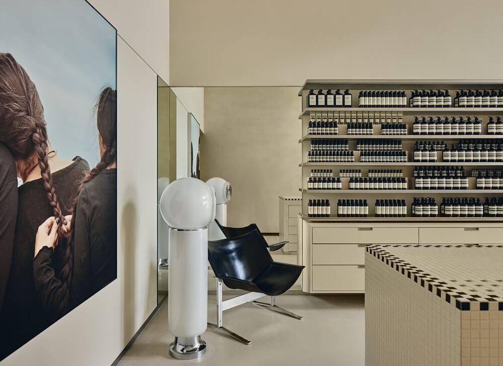Product wall and seating inside Aesop High Street Armadale