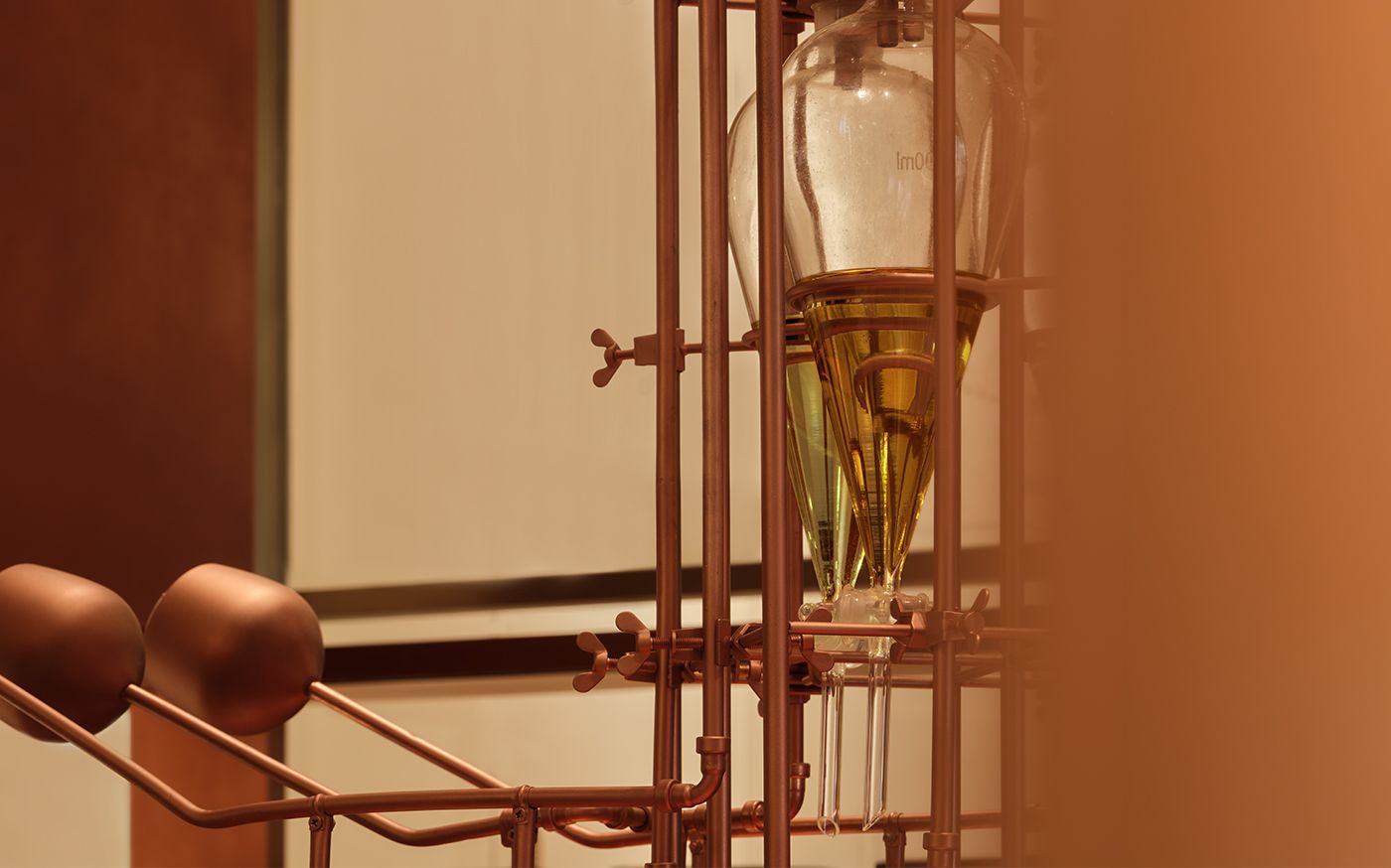 Detail of copper cones and glass vessels in Aesop’s olfactory sculpture