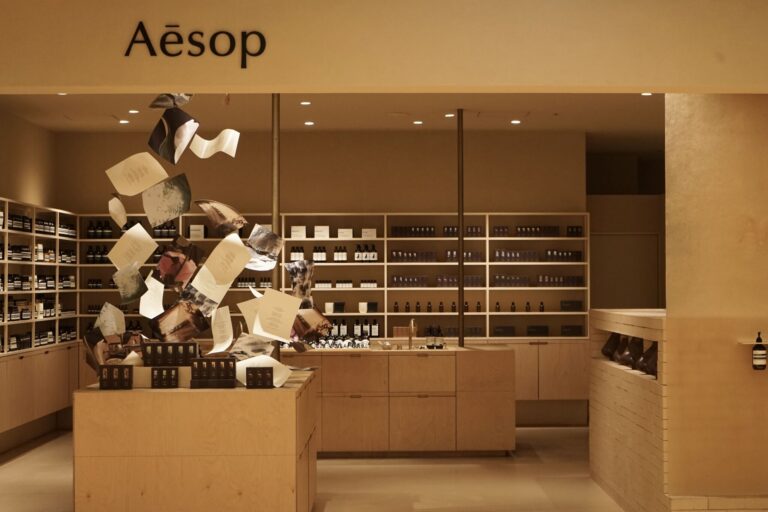 Aesop fragrance display with suspended paper-like forms