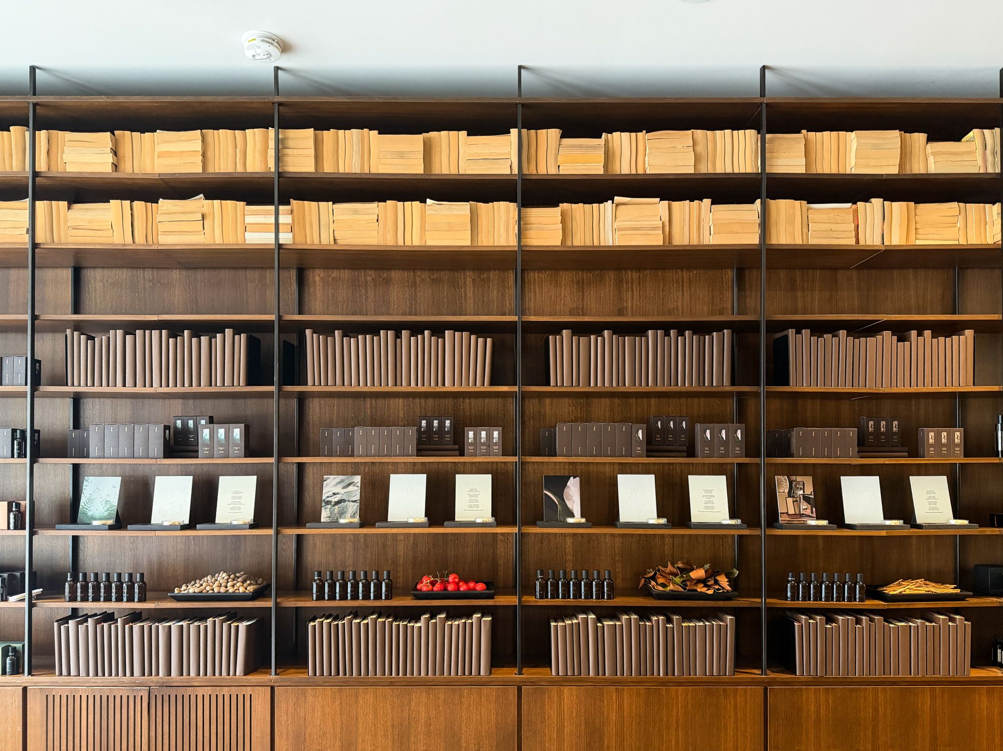 Fragrances displayed among books at an Aesop store