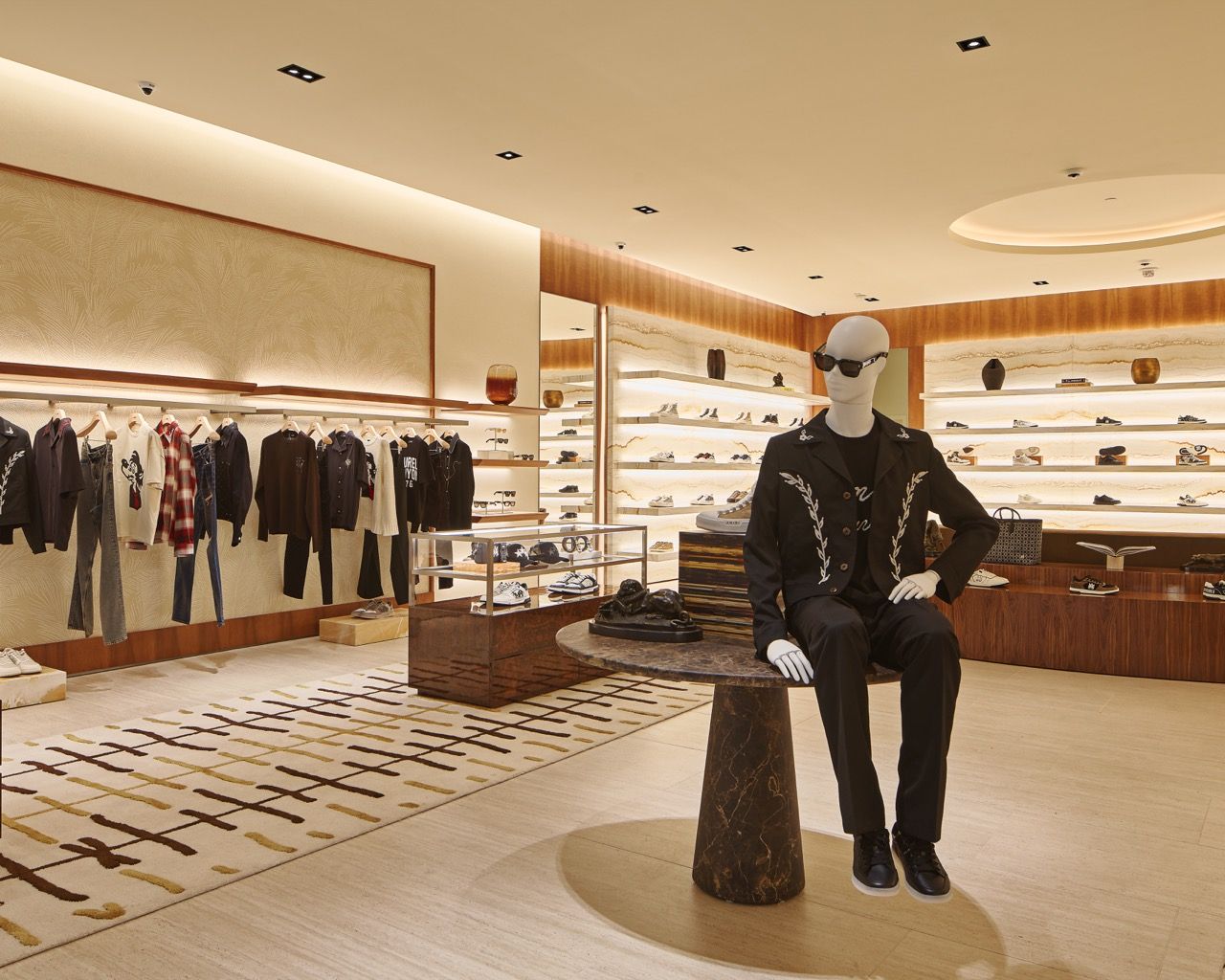 Mannequin and display table inside AMIRI Scottsdale
