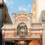 Royal Arcade entrance in London with Amouage pre-opening window graphics
