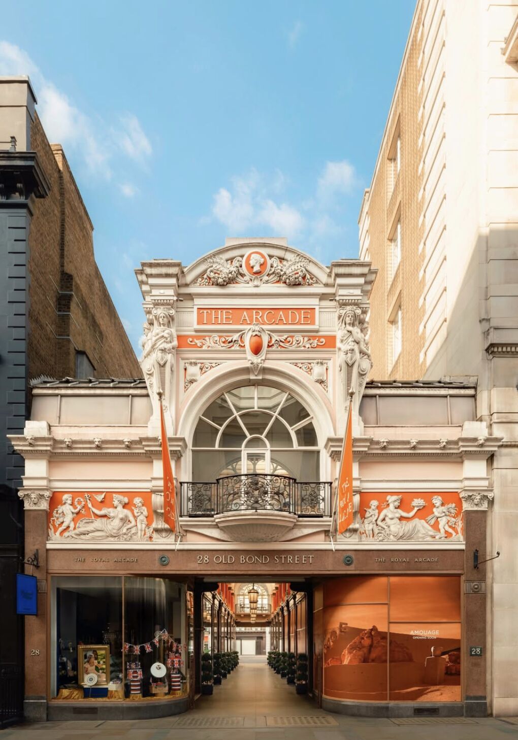 Royal Arcade entrance in London with Amouage pre-opening window graphics
