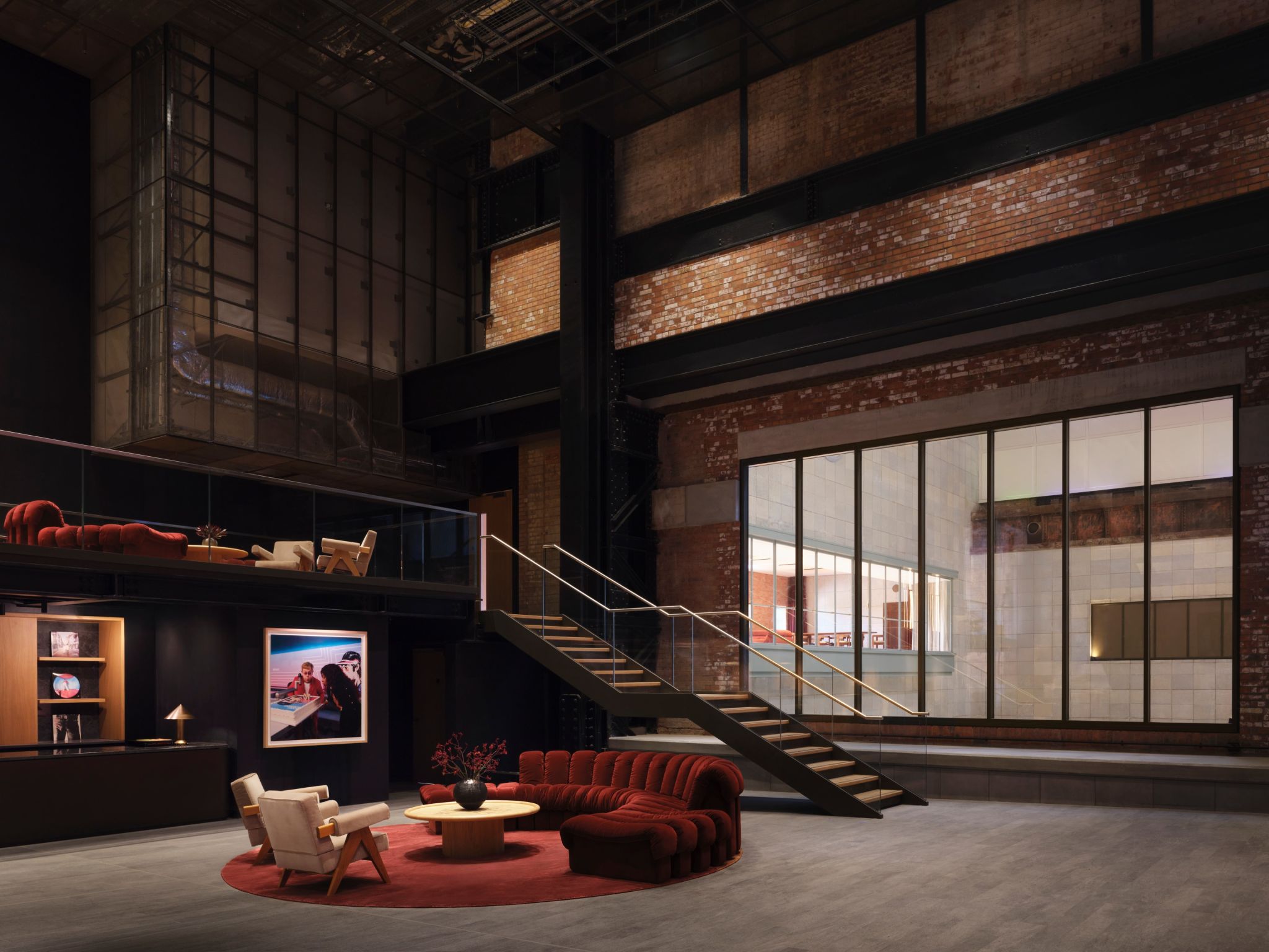 Foyer seating and stairway at Apple Music Hall inside Battersea Power Station