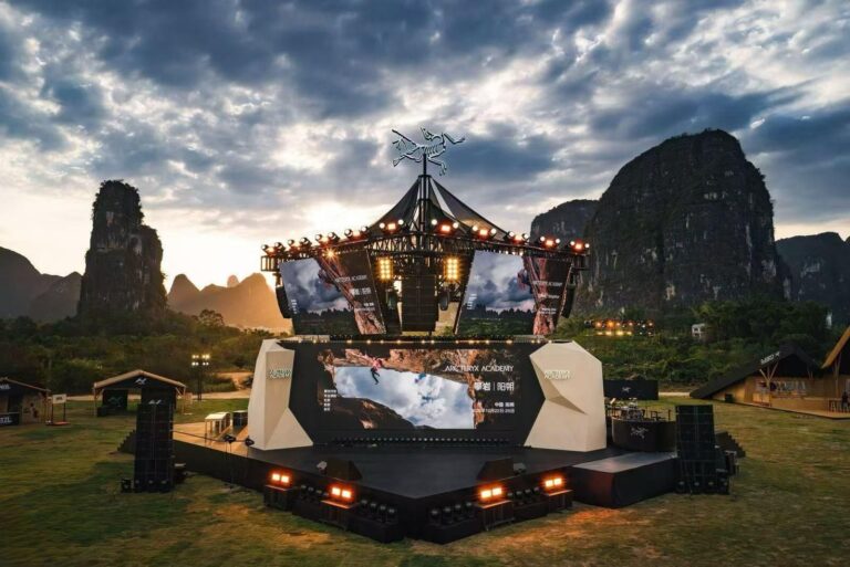 Arc’teryx Climbing Academy stage and screens against Yangshuo’s limestone hills