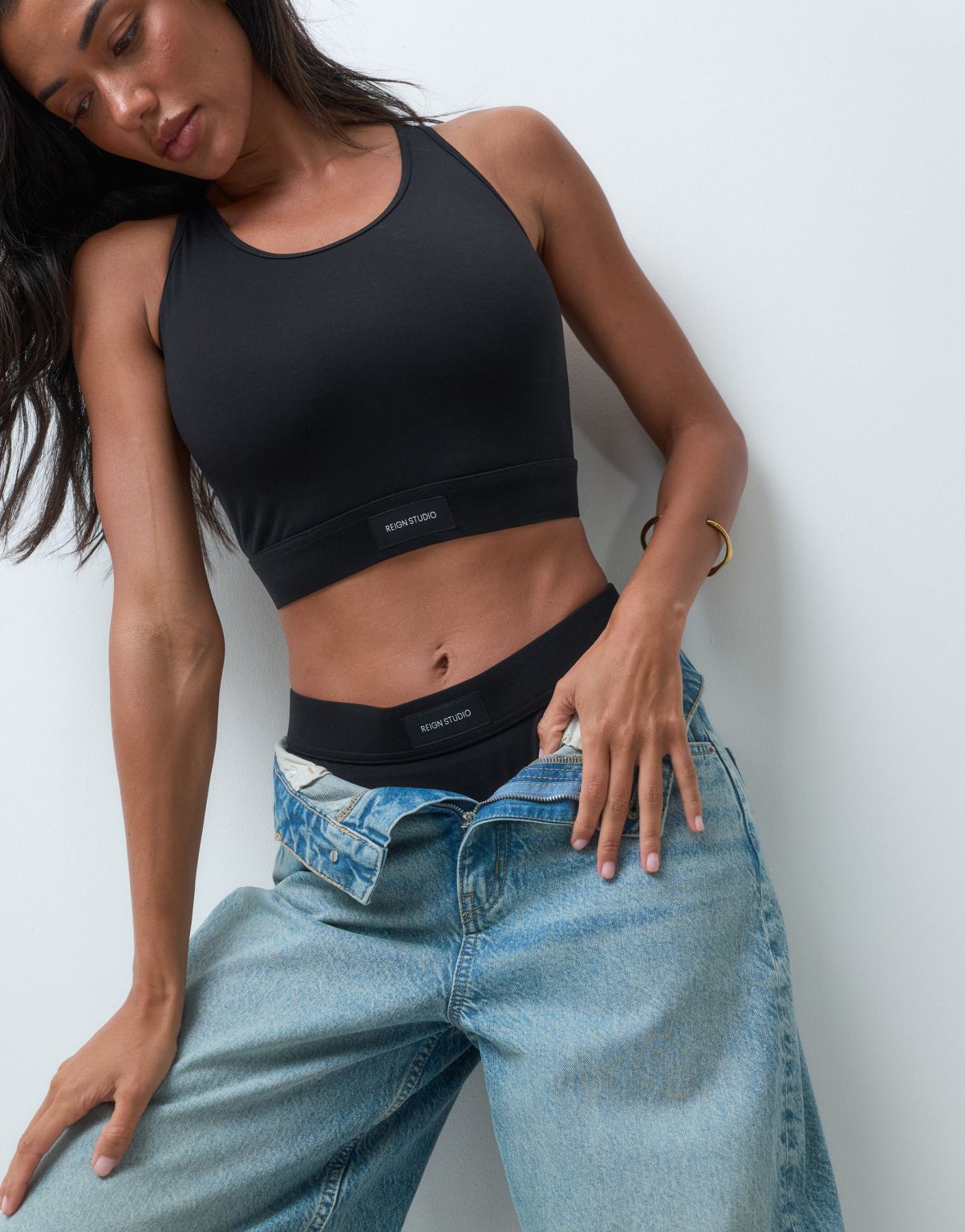 Reign Studio black wireless bralette styled with jeans