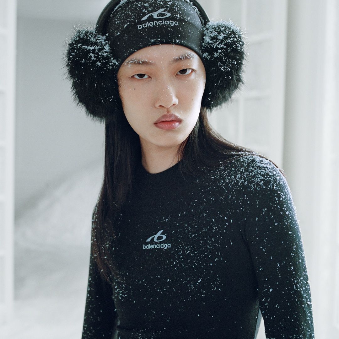 Model in a black Balenciaga winter hat and outerwear