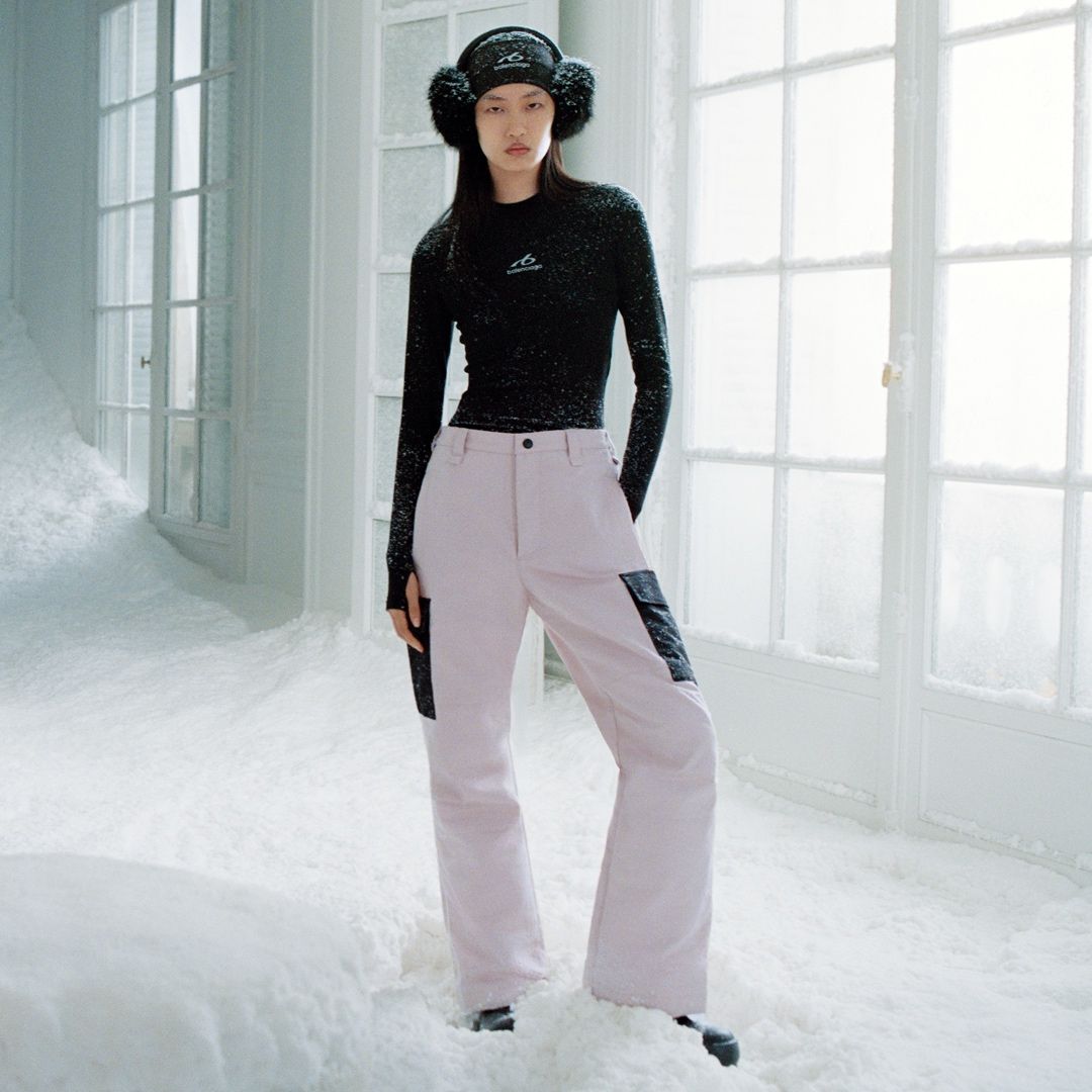 Model wearing pale Balenciaga pants and a black top